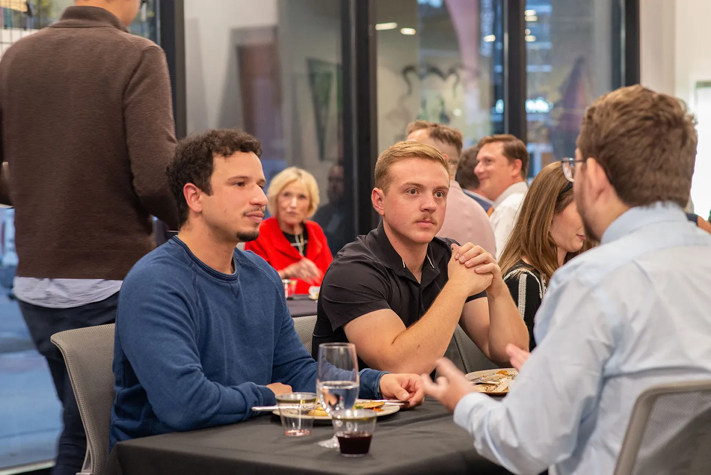 People sitting with food at UCCS Downtown.